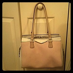 Calvin Klein light pink, white, and tan purse.